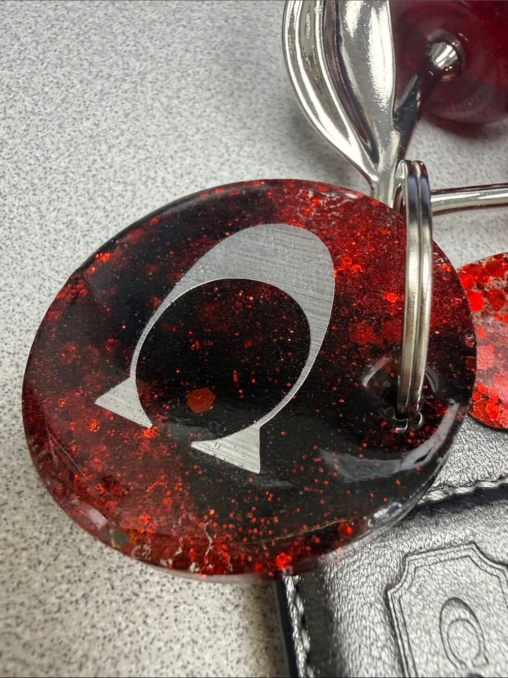 COACH Gunmetal Leather Tag with Red Glitter Cherry Keyring